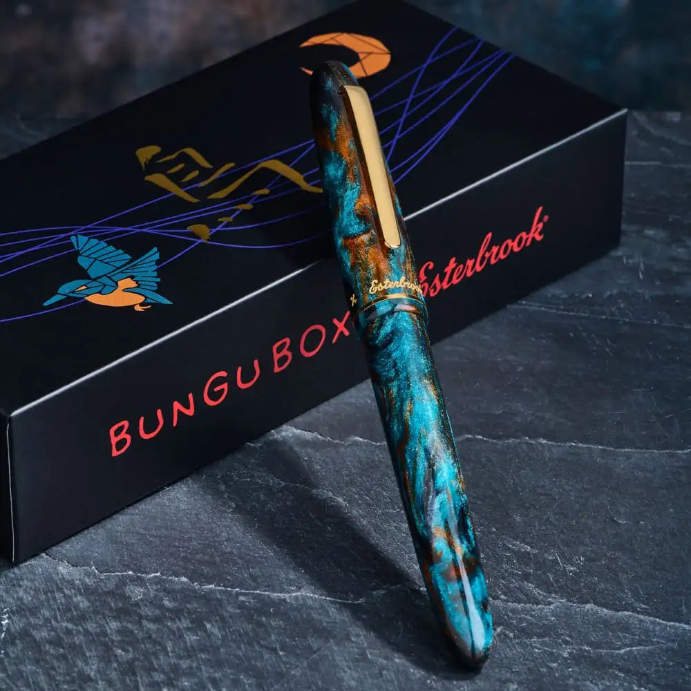 Blue and gold resin fountain pen with a crescent moon design, esterbrook brand.